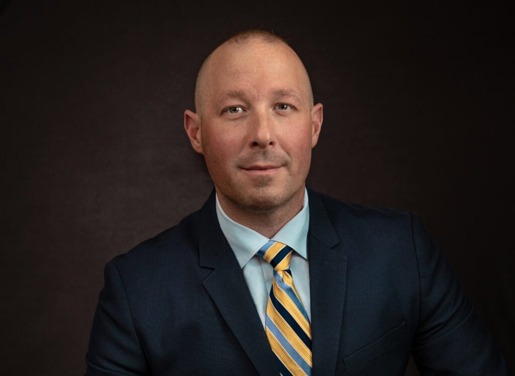 a professional headshot of a man photographed by a branding photographer Austin TX
