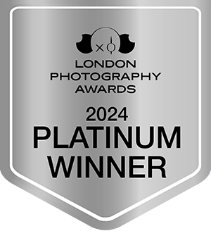 A silver badge reads "London Photography Awards 2024 Platinum Winner" with a camera logo above the text. Tanya Eivin Photography