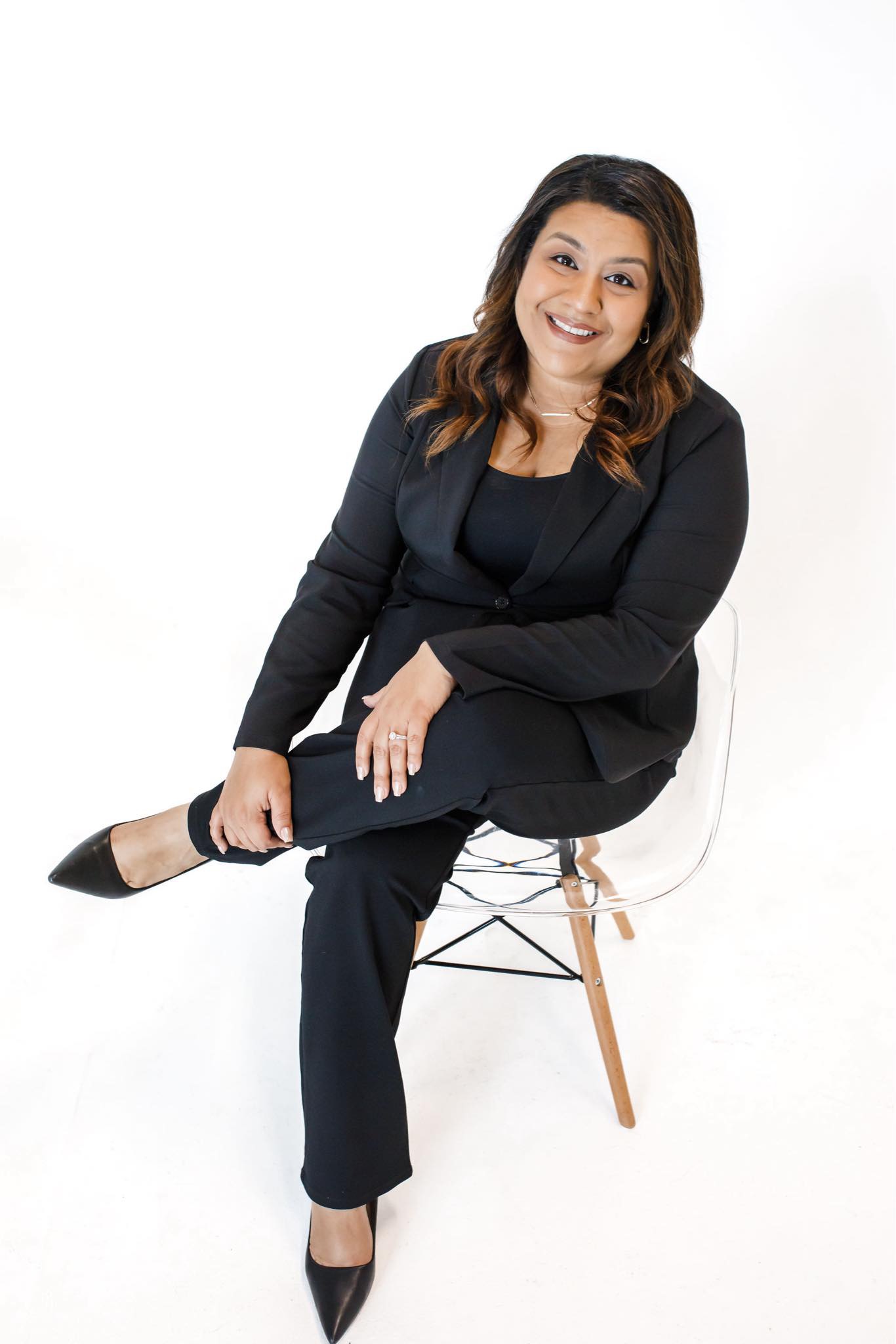 a branding photo of a woman sitting in a chair photographed by austin portrait photographer tanya eivin