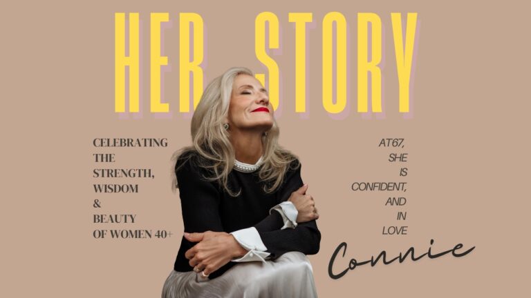 A smiling older woman with long gray hair sits in front of text highlighting the strength, wisdom, and beauty of women over 40, with the words “Her Story” in large yellow letters. Tanya Eivin Photography