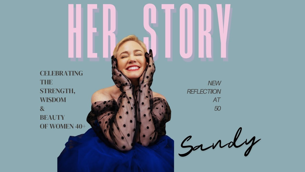 Smiling woman in a blue tulle skirt and black polka-dot gloves with "Her Story" and text celebrating women over 40, featuring "Sandy: New Reflection at 50. Tanya Eivin Photography