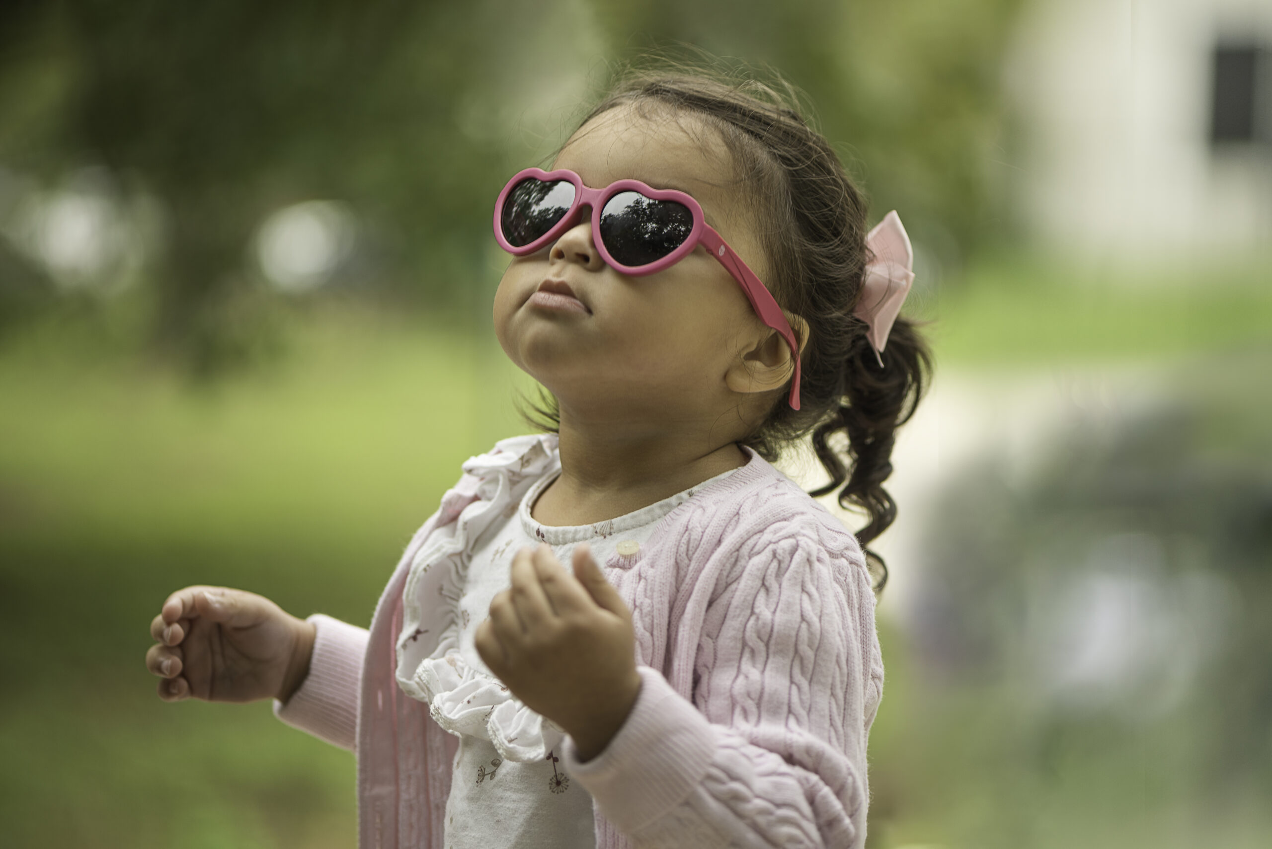 Portrait of a young girl in sunglasses created by a real photographer not AI