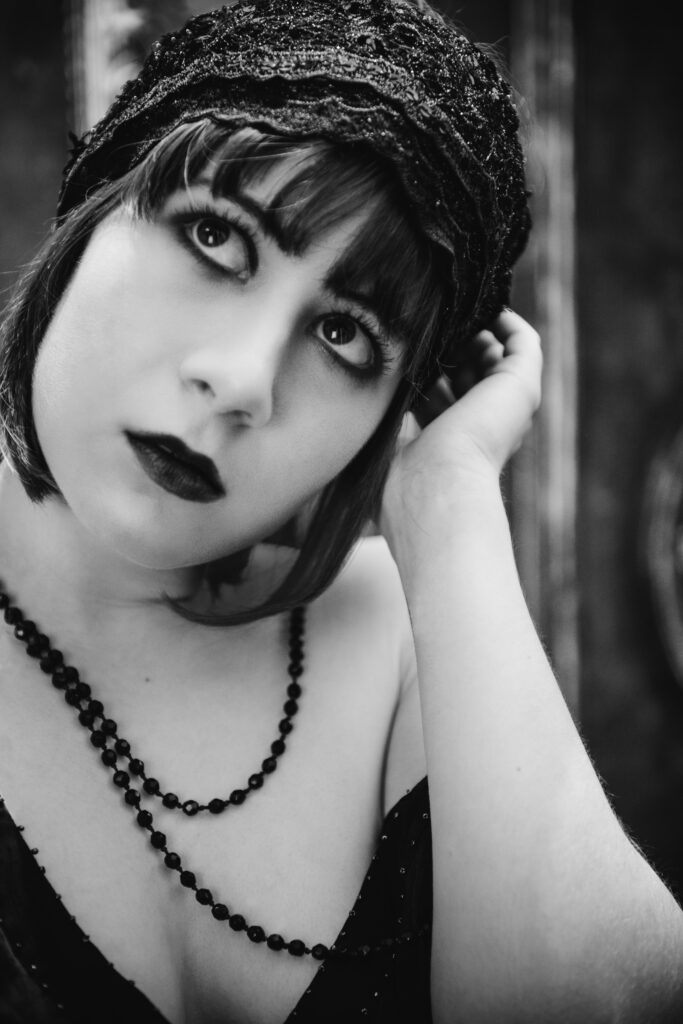 a black and white image of a creative senior portrait